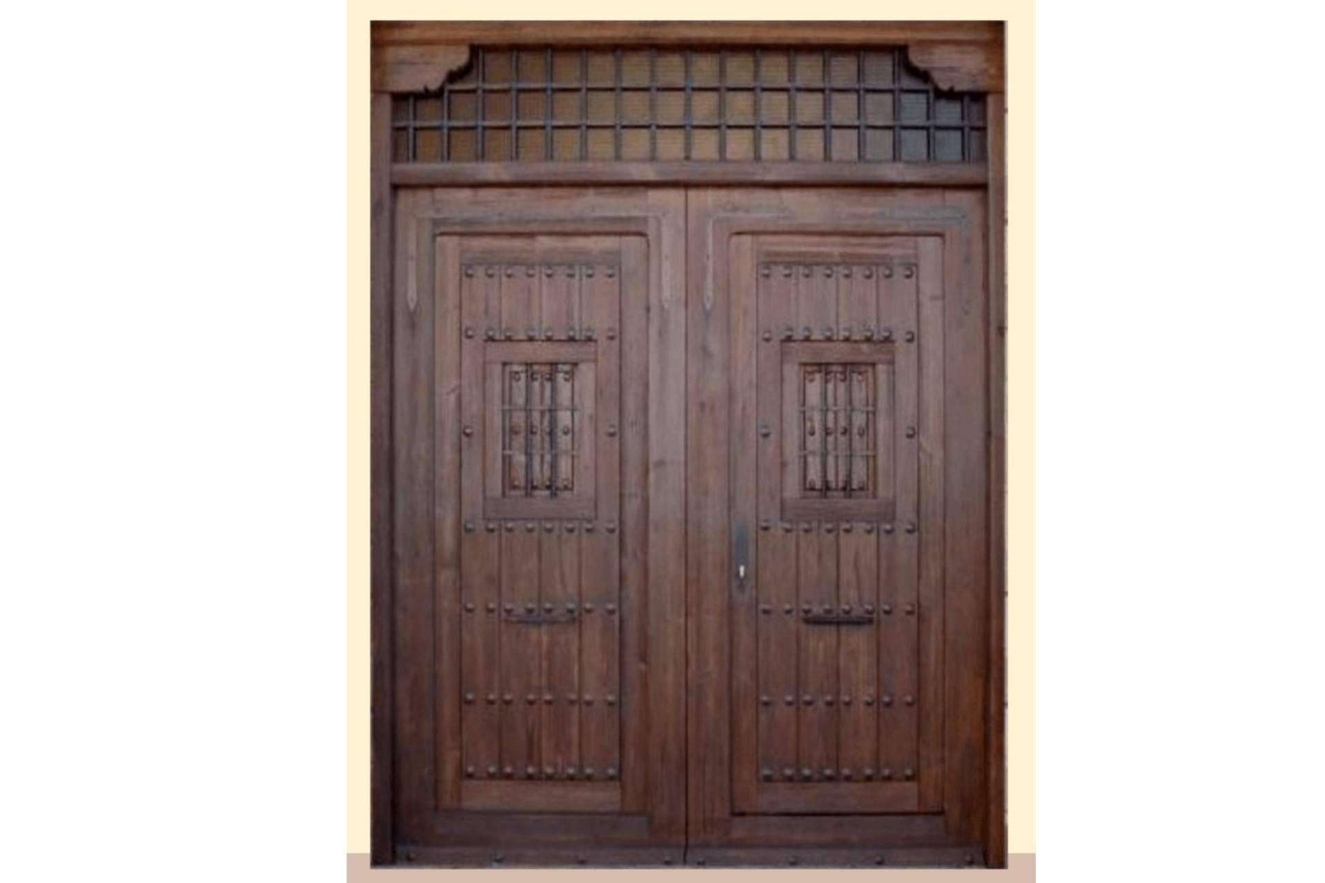 La puerta rústica exterior es el toque en la decoración de fincas, por Losma Studio